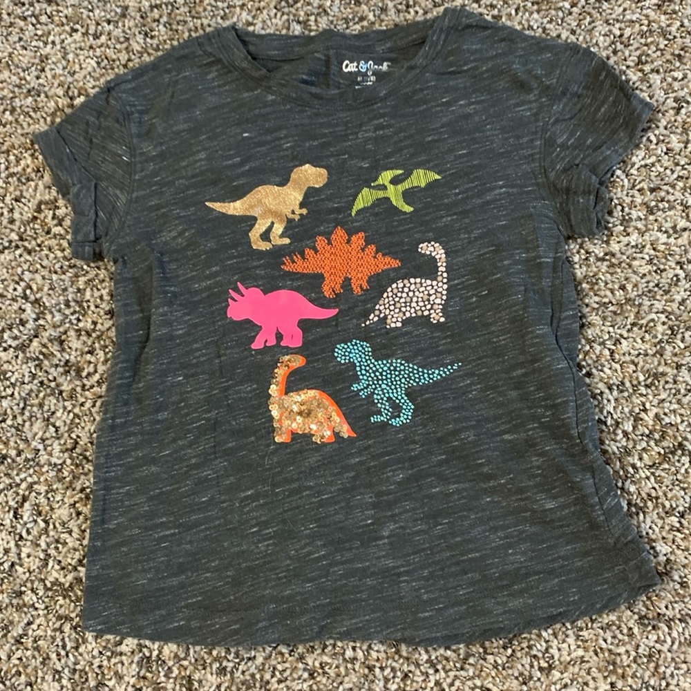 Super cute Cat & Jack girls dinosaur shirt. Has designs on front and back.